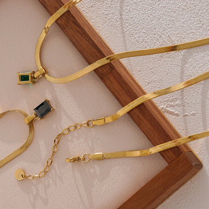 Nova Glow - Gold Flat Snake Necklace with Green Crystal